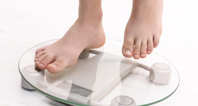 standing on scales