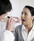 the doctor first examines the oral cavity